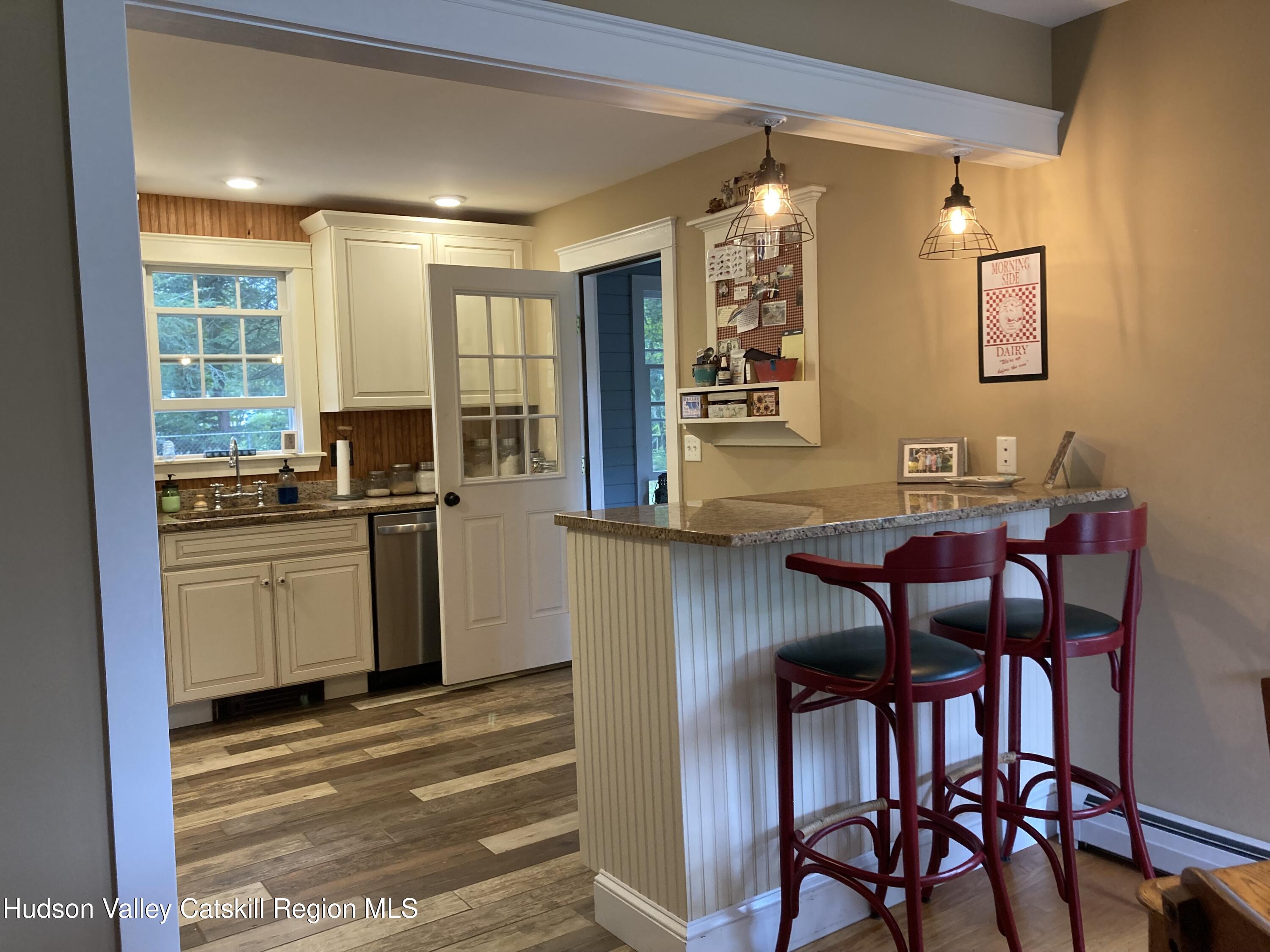 14 Knoth Road Wallkill, NY 12589 - Photo 14 of 46 a kitchen with a table chairs stove and cabinets
