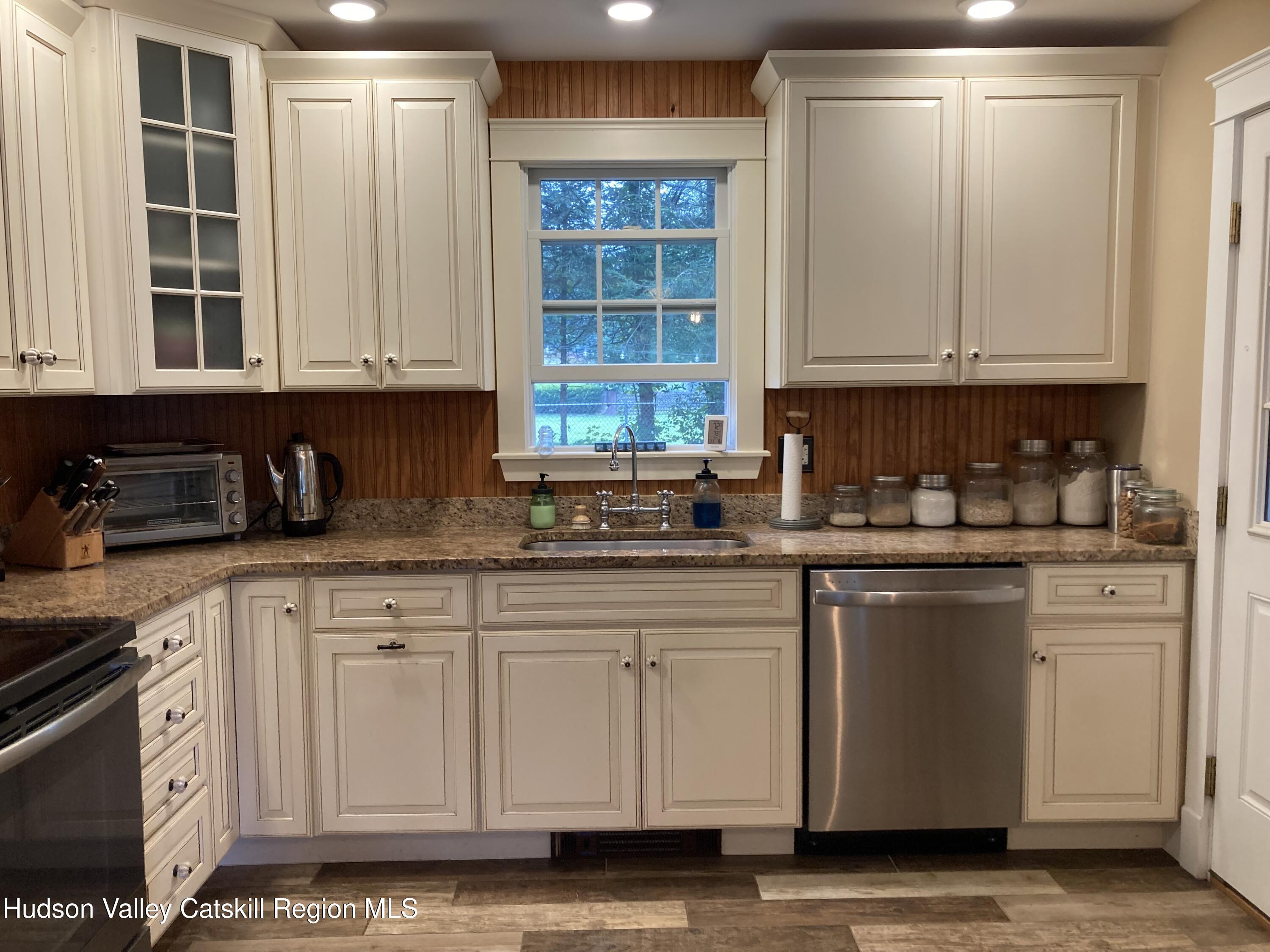 14 Knoth Road Wallkill, NY 12589 - Photo 16 of 46 a kitchen with granite countertop white cabinets and sink