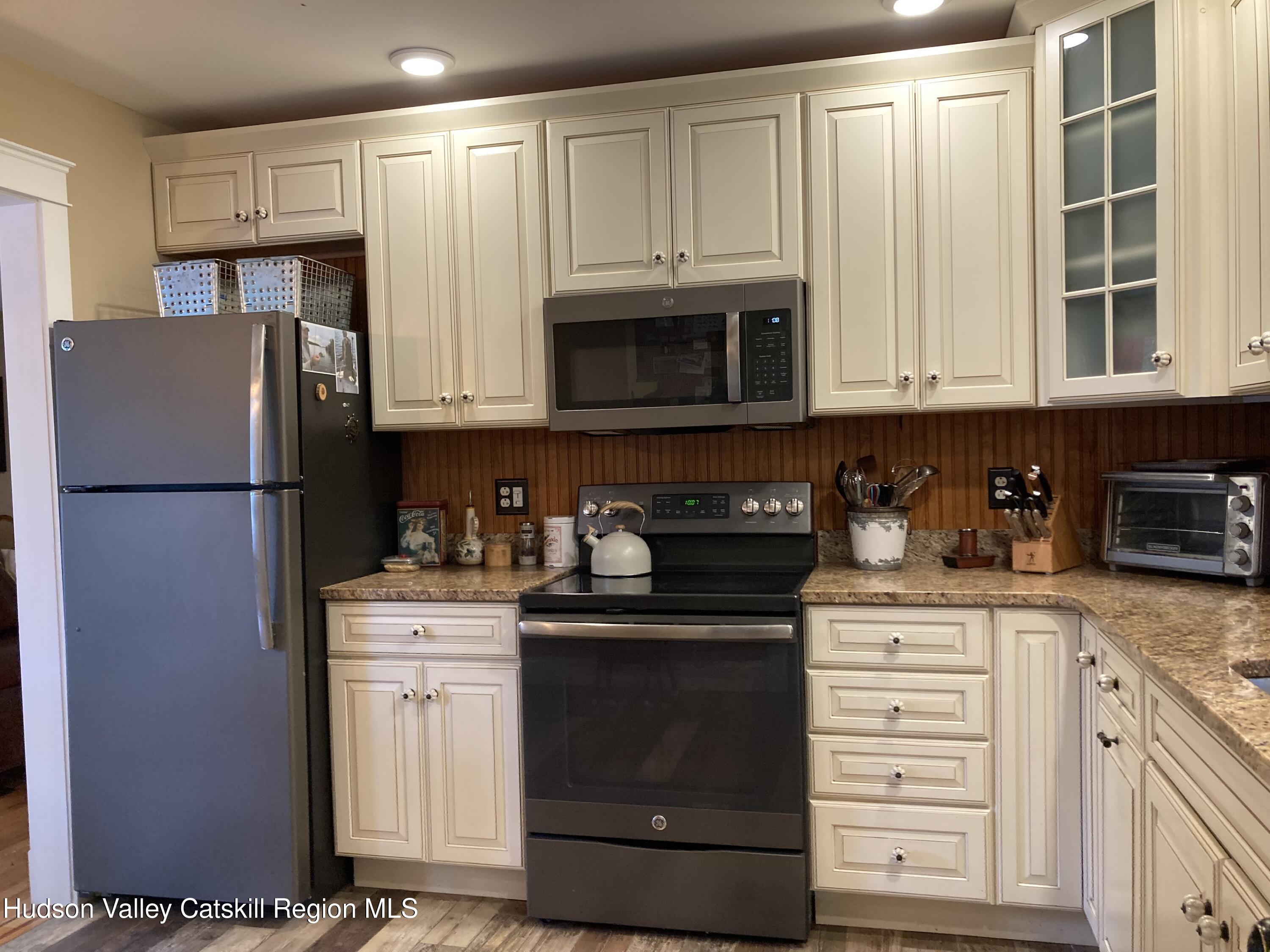 14 Knoth Road Wallkill, NY 12589 - Photo 17 of 46 a kitchen with granite countertop a refrigerator stove and a sink