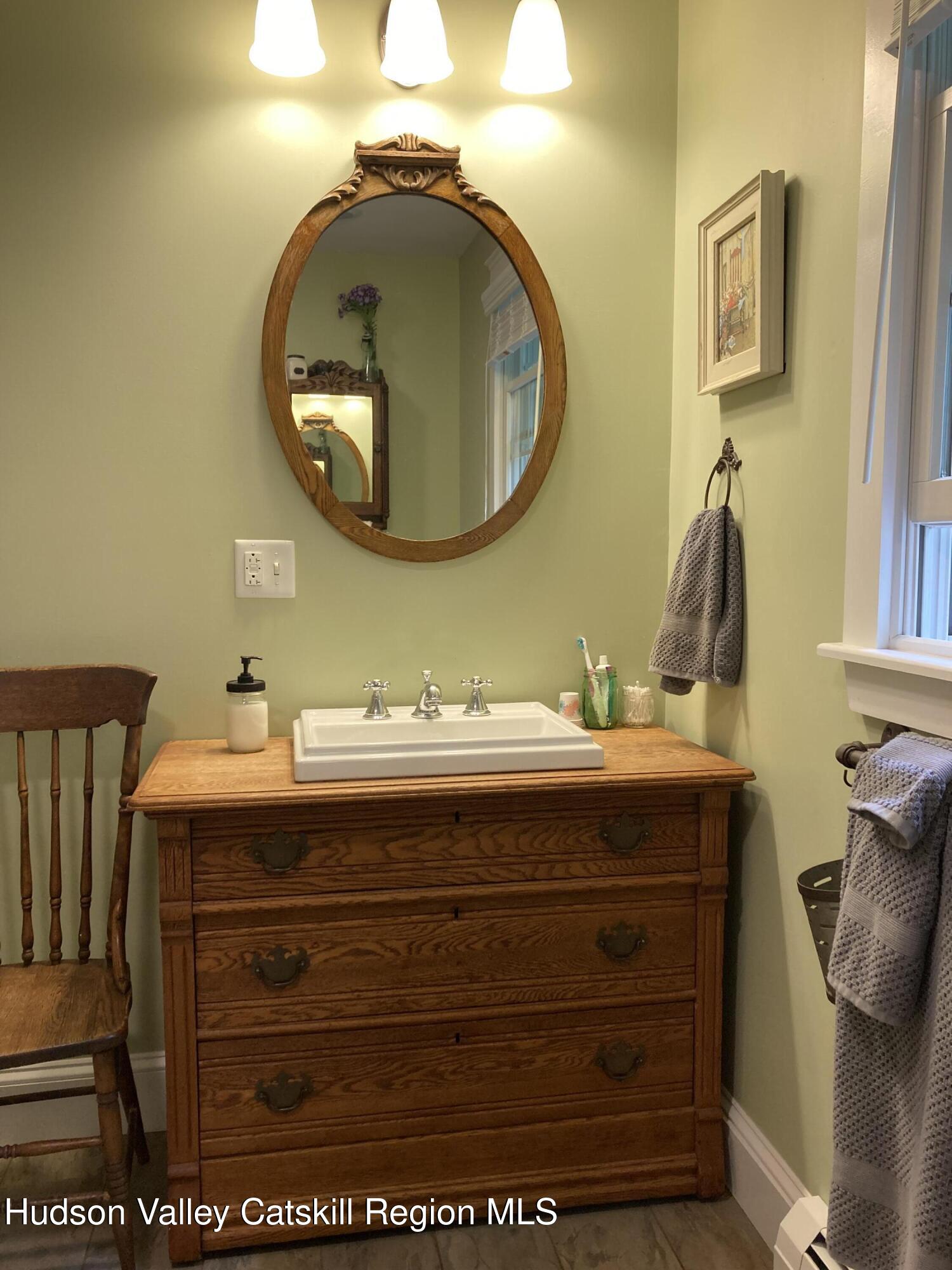 14 Knoth Road Wallkill, NY 12589 - Photo 19 of 46 a bathroom with a sink a mirror and vanity