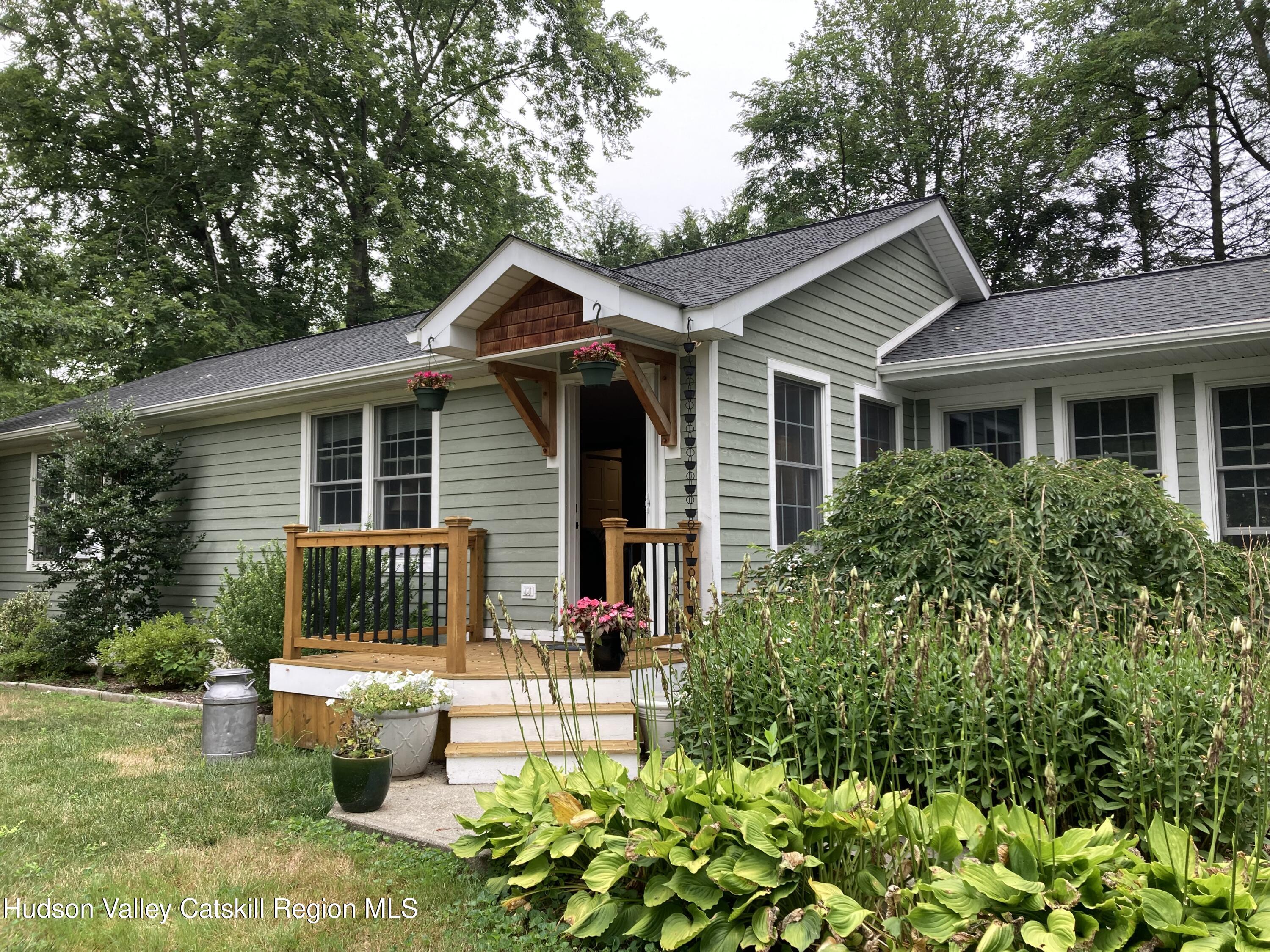 14 Knoth Road Wallkill, NY 12589 - Photo 2 of 46 a view of a house with a yard and potted plants