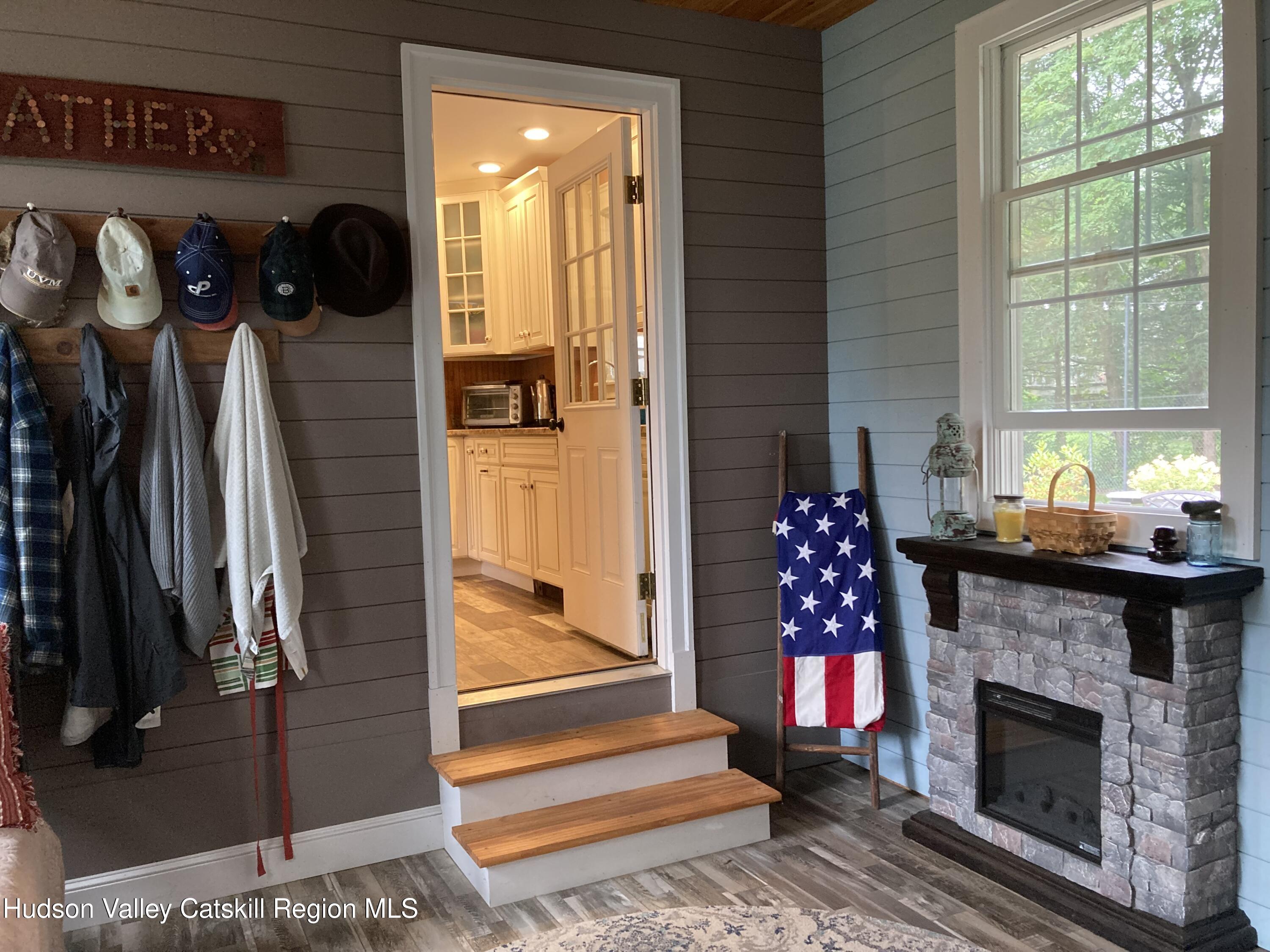 14 Knoth Road Wallkill, NY 12589 - Photo 27 of 46 a living room with furniture and a fireplace
