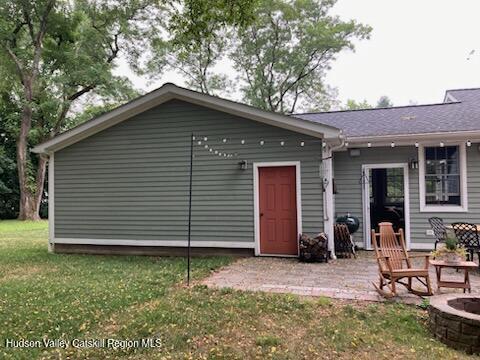 14 Knoth Road Wallkill, NY 12589 - Photo 39 of 46 a small barn with a white roof and table and chairs