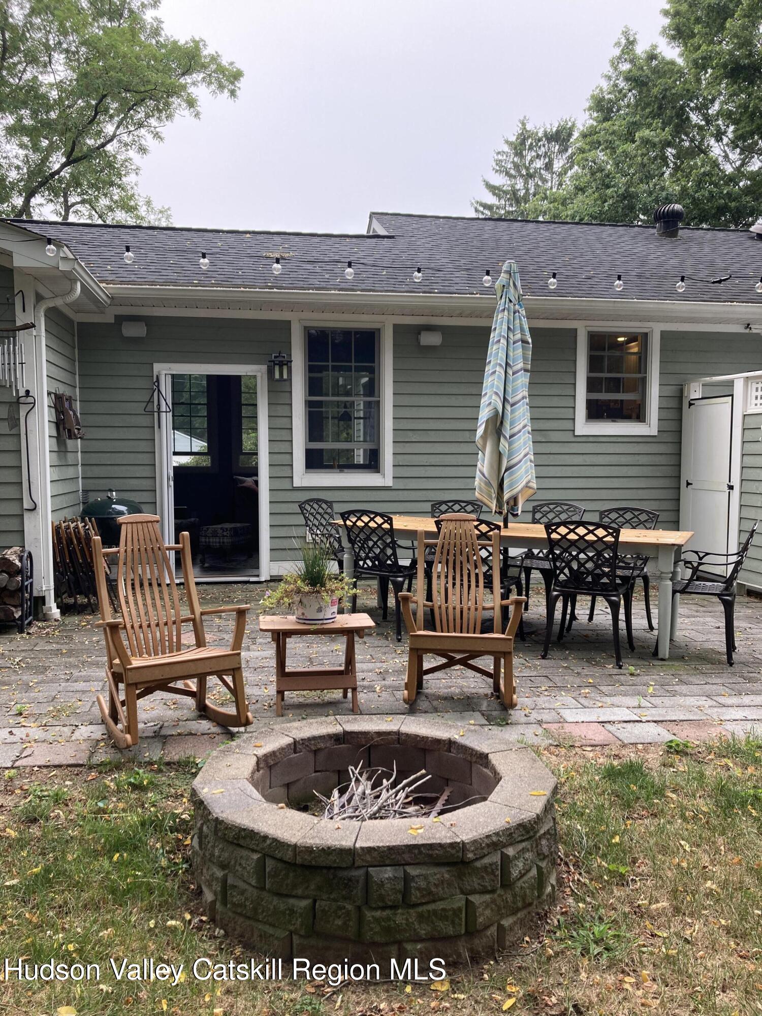 14 Knoth Road Wallkill, NY 12589 - Photo 41 of 46 a patio with a table and chairs and a barbeque