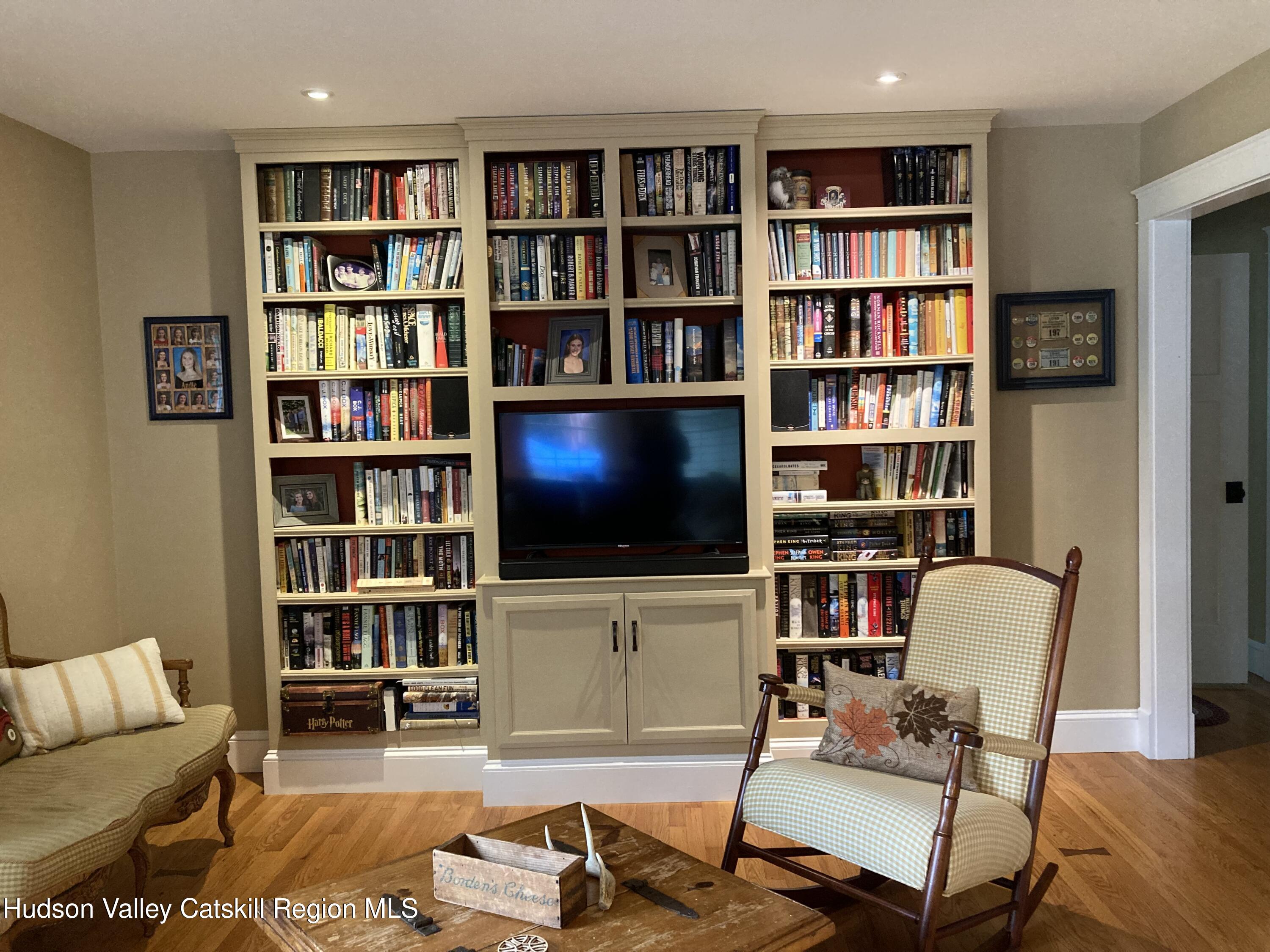 14 Knoth Road Wallkill, NY 12589 - Photo 9 of 46 a living room with furniture and a book shelf
