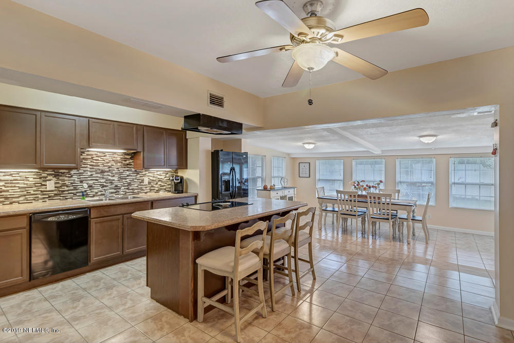 6026 Temple Road Jacksonville, FL 32217 - Photo 6 of 13 a kitchen with lots of table and chairs