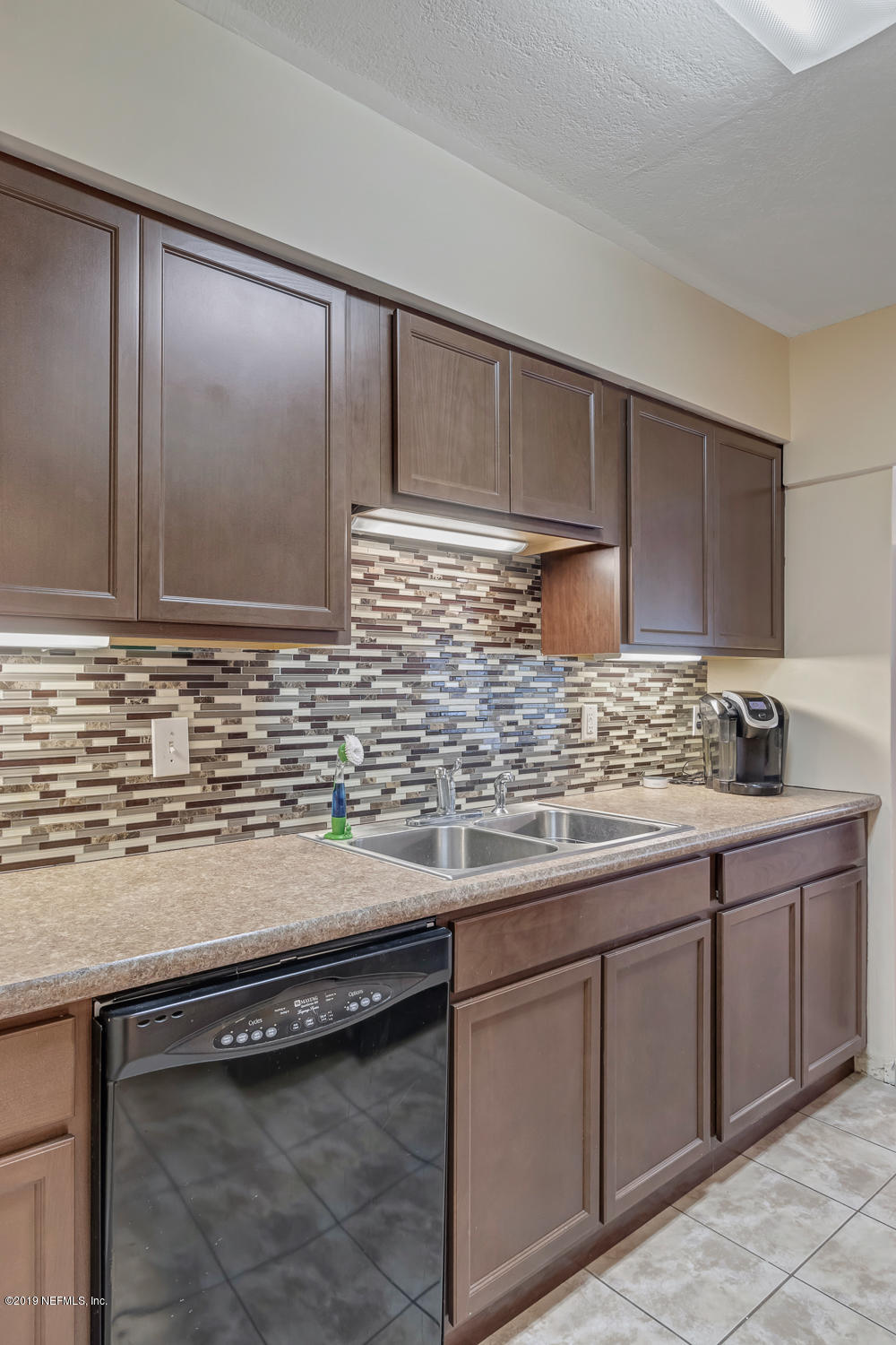 6026 Temple Road Jacksonville, FL 32217 - Photo 8 of 13 a kitchen with granite countertop cabinets and sink