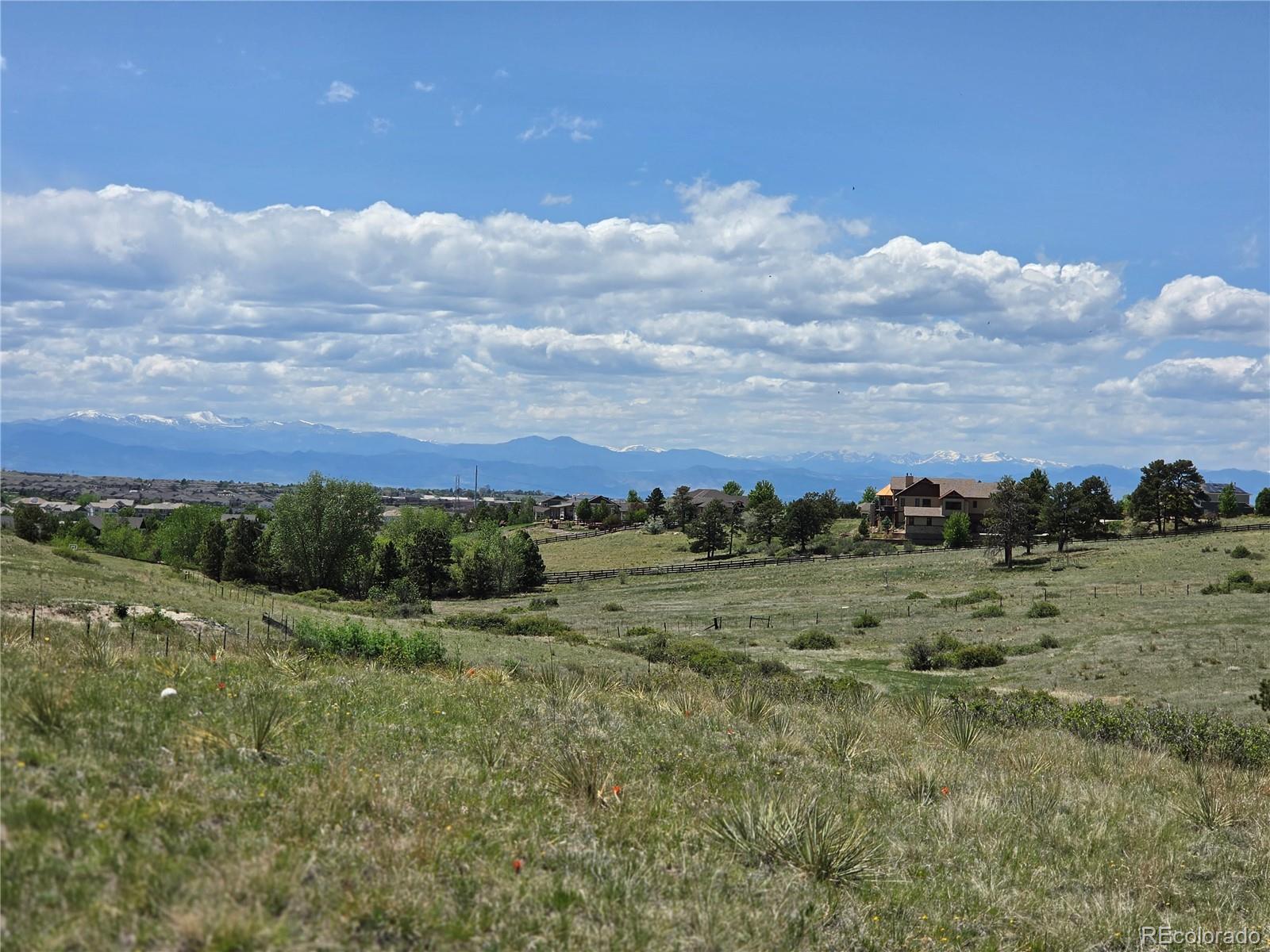 Forest Rim Road Aurora, CO 80016 - Photo 13 of 15 a view of a field with an ocean