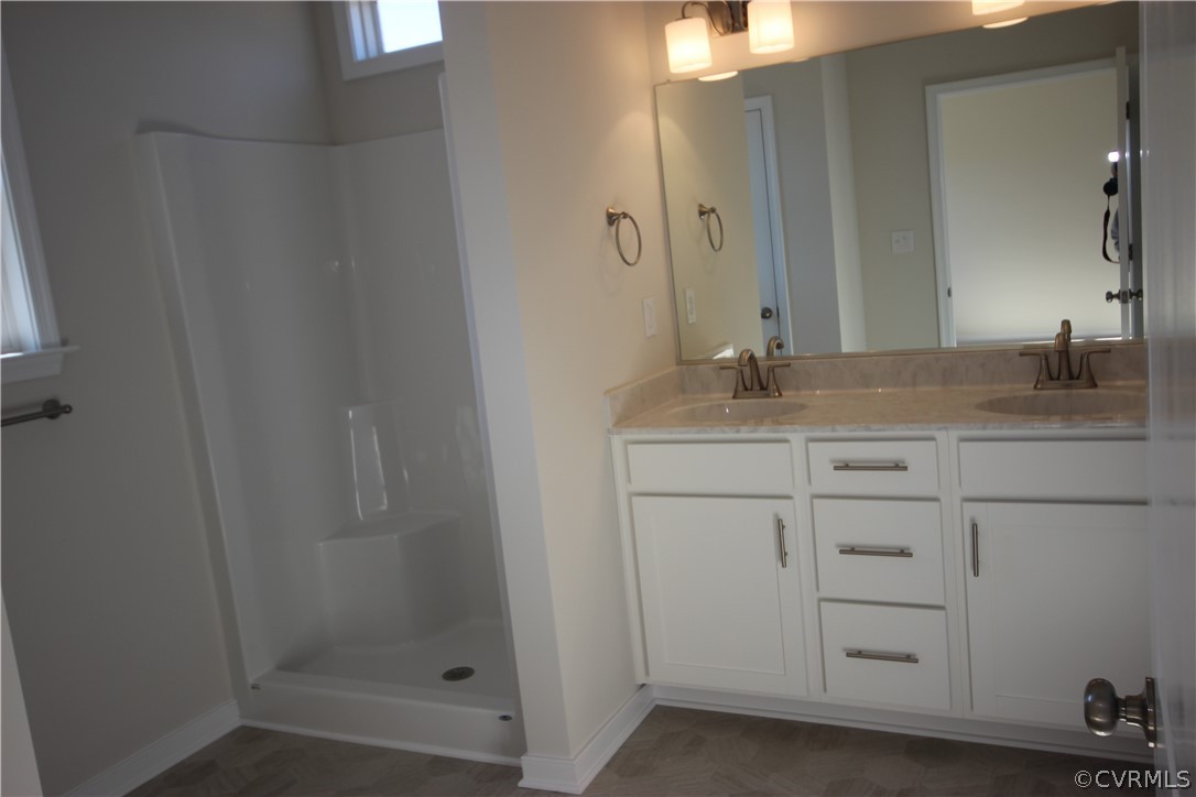 209 New S Ridge Road Bumpass, VA 23024 - Photo 13 of 26 a bathroom with a granite countertop sink and a mirror