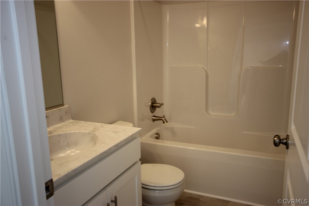 209 New S Ridge Road Bumpass, VA 23024 - Photo 17 of 26 a bathroom with a granite countertop bathtub shower sink vanity and toilet