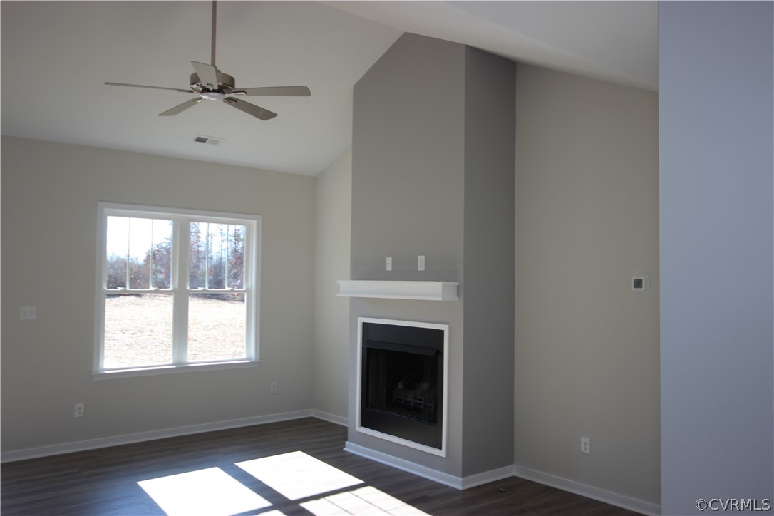 209 New S Ridge Road Bumpass, VA 23024 - Photo 5 of 26 a living room with a fireplace and a window