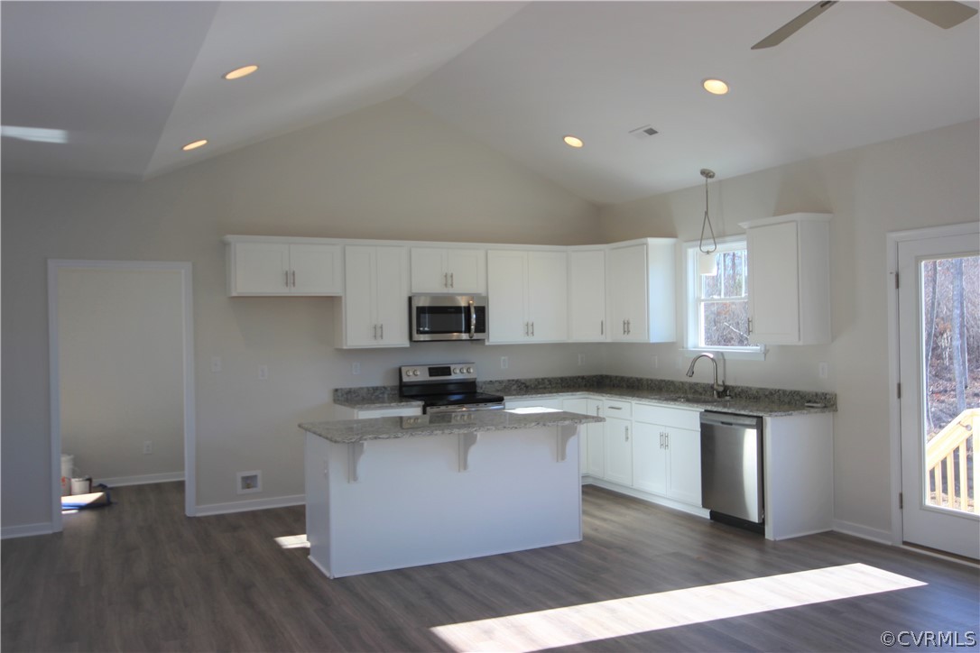 209 New S Ridge Road Bumpass, VA 23024 - Photo 7 of 26 a kitchen with stainless steel appliances granite countertop a sink a stove a refrigerator and cabinets
