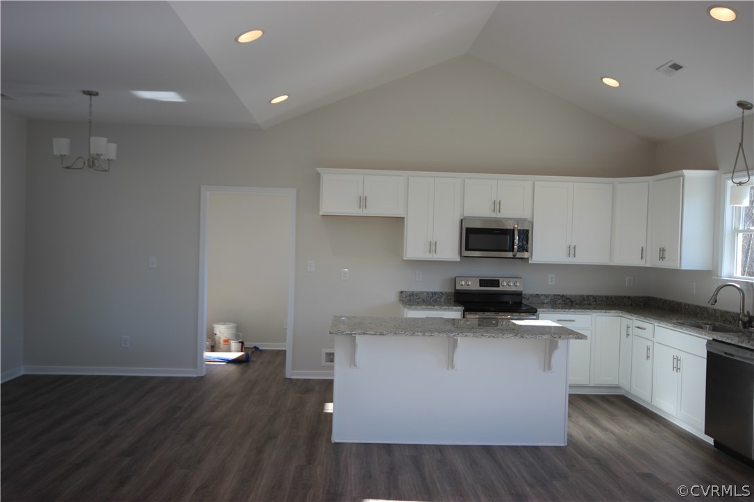 209 New S Ridge Road Bumpass, VA 23024 - Photo 8 of 26 a kitchen with stainless steel appliances a sink a stove a microwave and cabinets