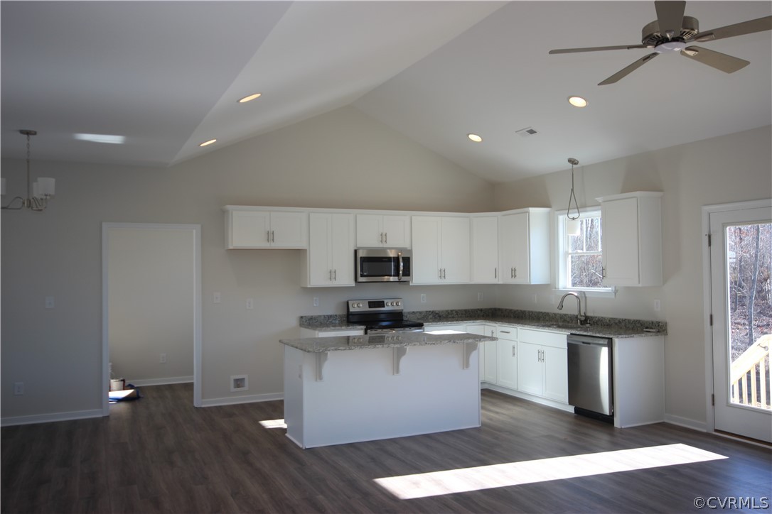 209 New S Ridge Road Bumpass, VA 23024 - Photo 9 of 26 a kitchen with stainless steel appliances granite countertop a sink a stove a refrigerator and cabinets