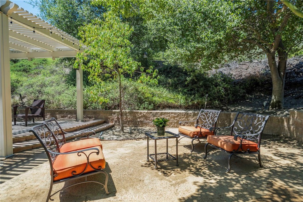 2 Swallows Lane Trabuco Canyon, CA 92679 - Photo 21 of 71 an outdoor sitting area with couch and chairs