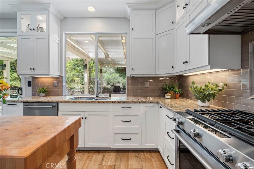 2 Swallows Lane Trabuco Canyon, CA 92679 - Photo 29 of 71 a kitchen with white cabinets and appliances