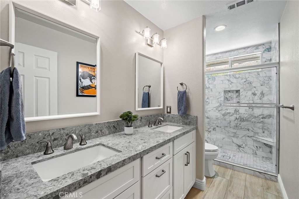 2 Swallows Lane Trabuco Canyon, CA 92679 - Photo 54 of 71 Guest bathroom with dual sinks & walk-in shower.