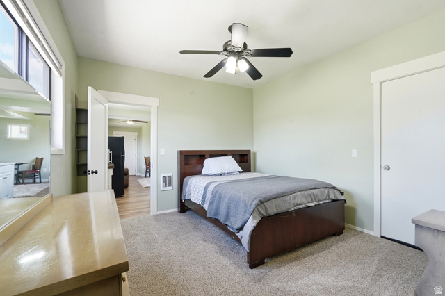4540 Dingle Road Dingle, ID 83233 - Photo 20 of 22 Vaulted ceiling, ceiling fan with integrated lighting, window with white blinds, light-colored carpeting, white trim