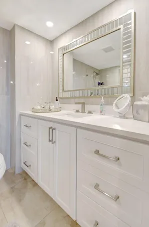 a bathroom with a double vanity sink and mirror