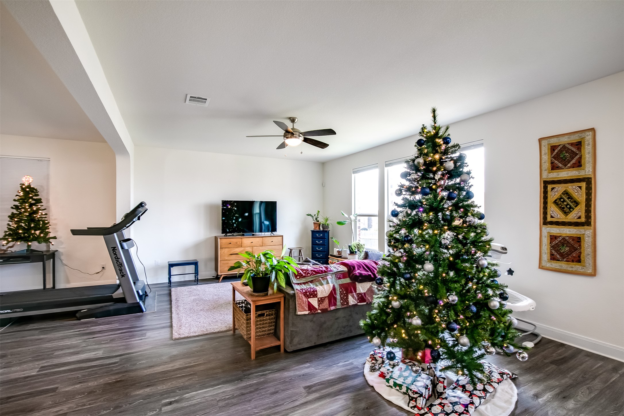 7616 Groundhog Way Austin, TX 78744 - Photo 6 of 34 a living room with furniture and a potted plant