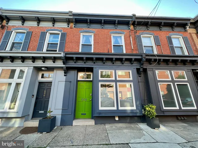 a front view of a building with glass windows