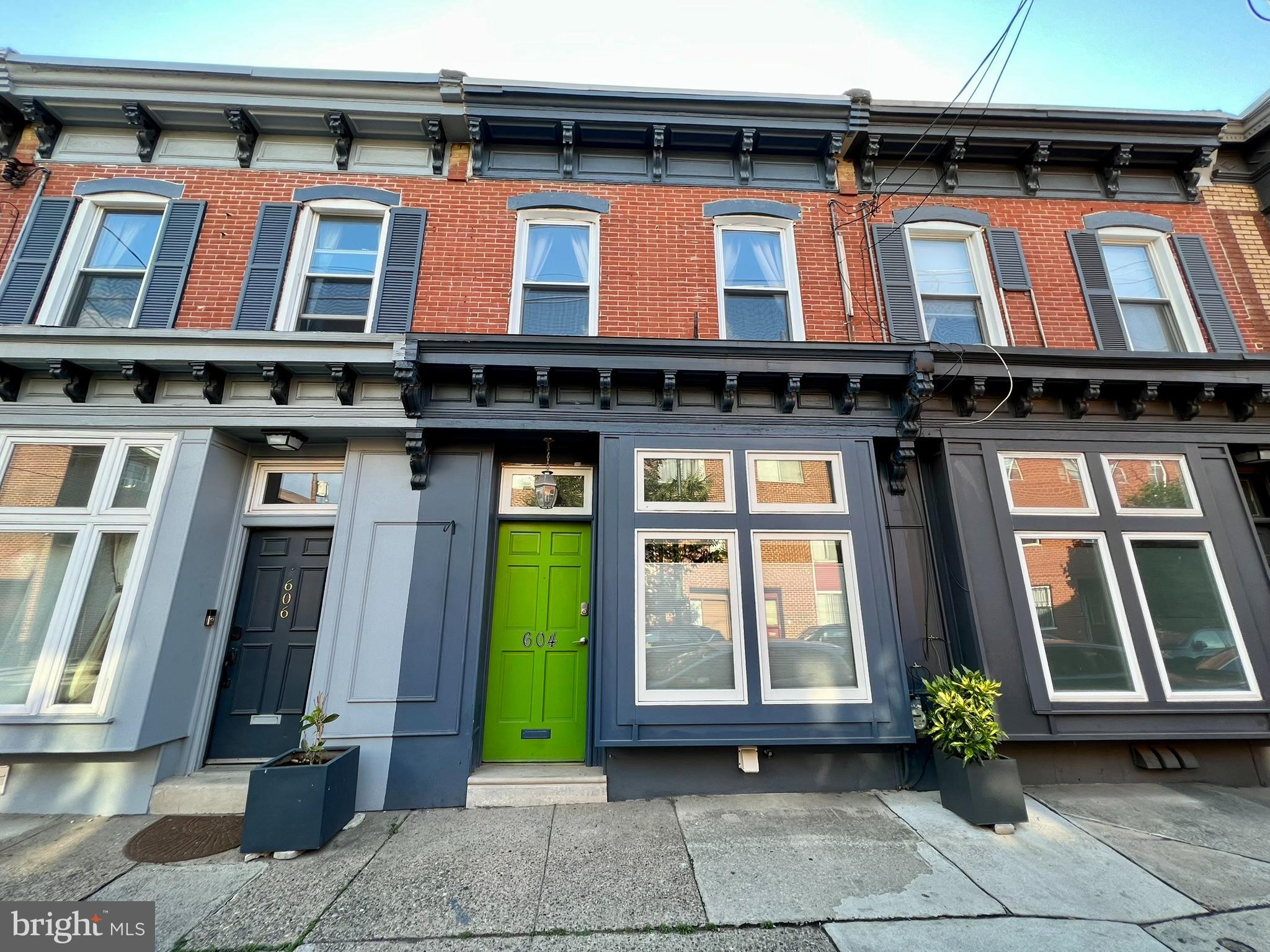 a front view of a building with glass windows
