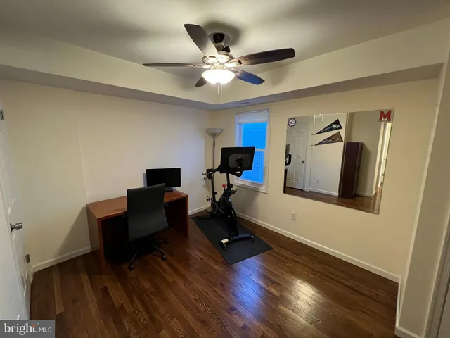 a work room with furniture and wooden floor