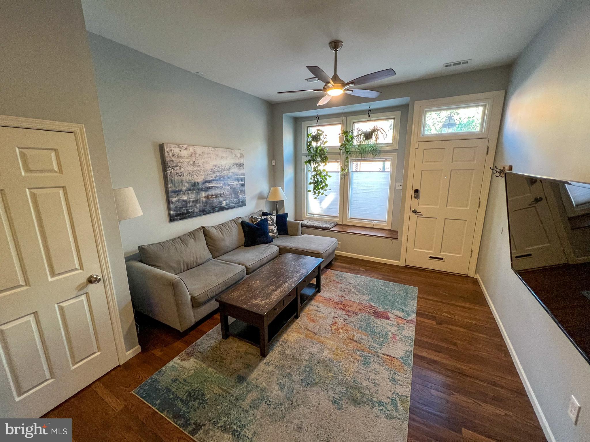604 South 12th Street Philadelphia, PA 19147 - Photo 2 of 14 a living room with furniture and a large window
