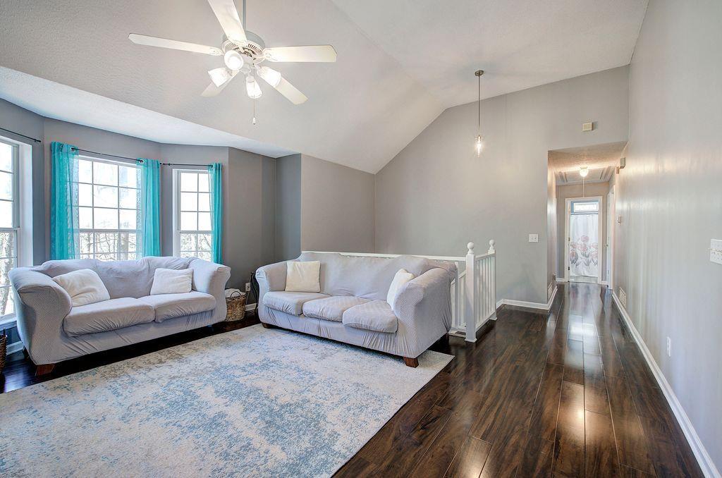 205 Cryder Lane Canton, GA 30115 - Photo 11 of 38 a living room with furniture and a large window