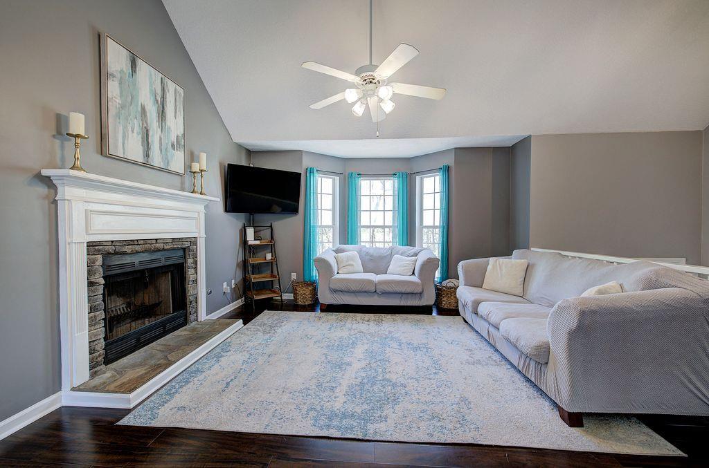 205 Cryder Lane Canton, GA 30115 - Photo 12 of 38 a living room with furniture and a fireplace