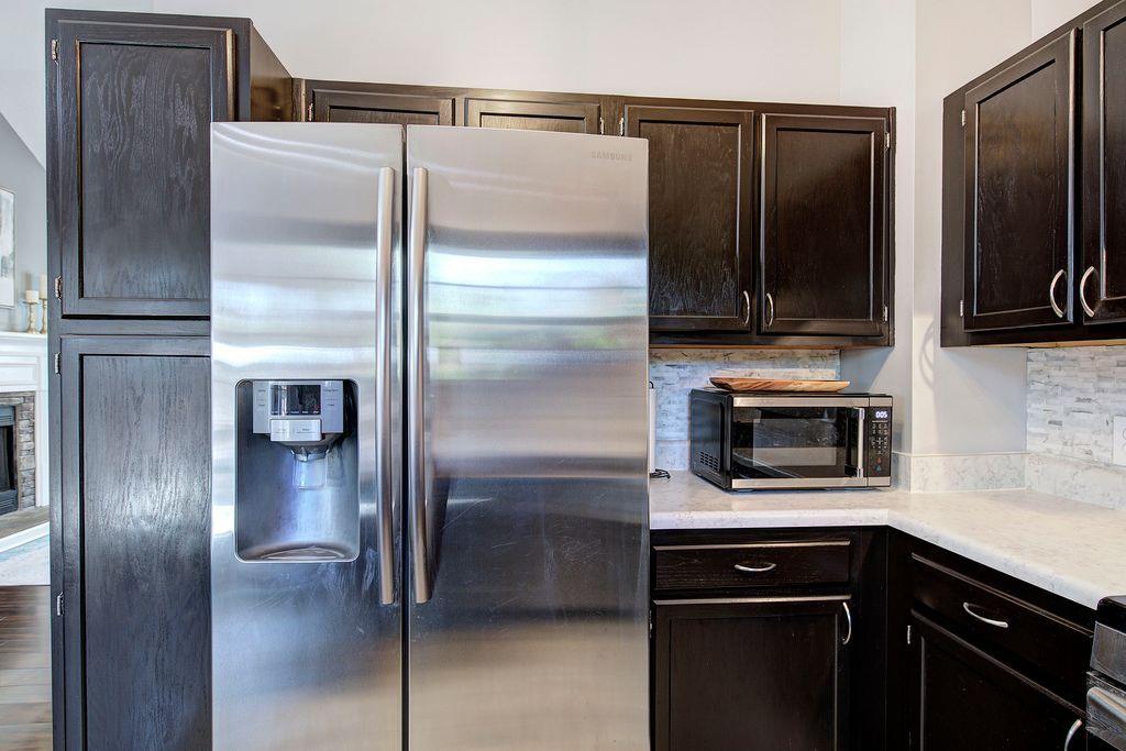 205 Cryder Lane Canton, GA 30115 - Photo 16 of 38 a kitchen with a refrigerator and a stove