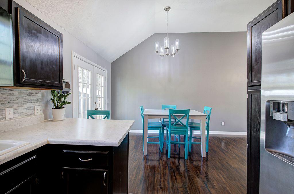 205 Cryder Lane Canton, GA 30115 - Photo 17 of 38 a view of a dining room with furniture and wooden floor