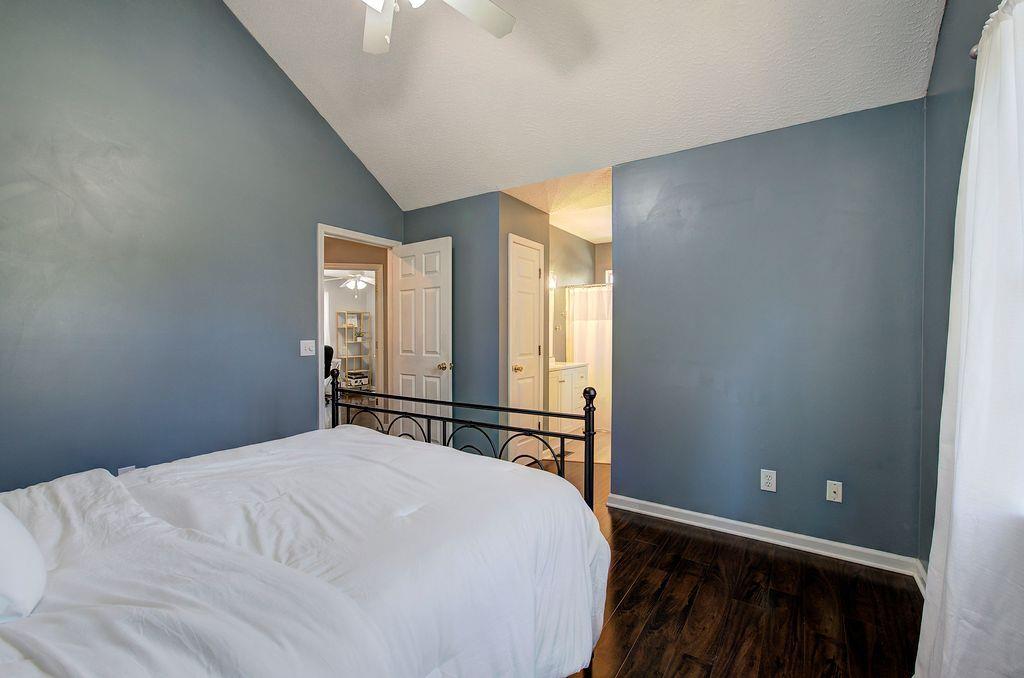 205 Cryder Lane Canton, GA 30115 - Photo 18 of 38 a bedroom with a bed and a window