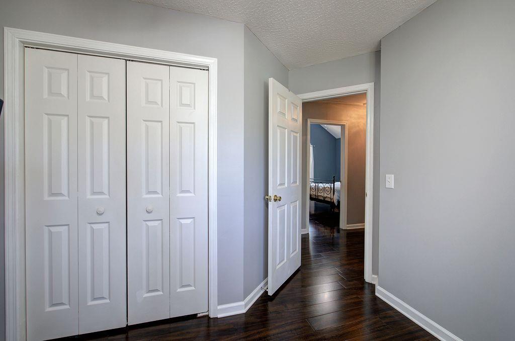 205 Cryder Lane Canton, GA 30115 - Photo 24 of 38 a view of a hallway with wooden floor