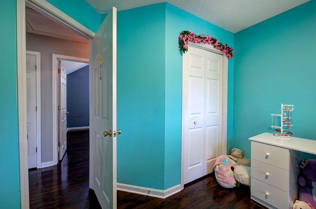 205 Cryder Lane Canton, GA 30115 - Photo 27 of 38 a room with a refrigerator and a sink