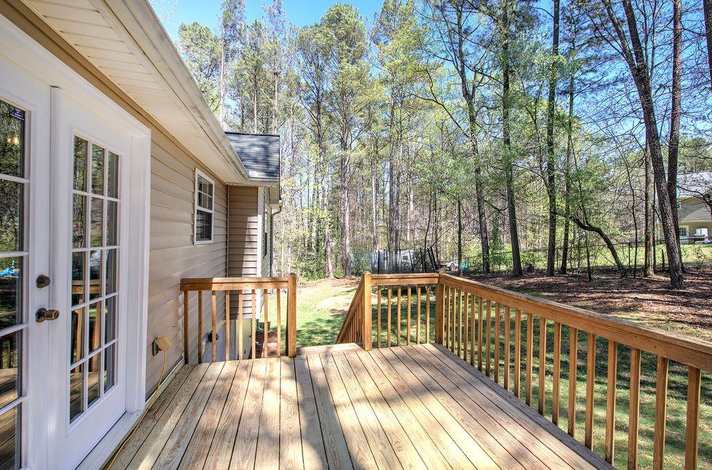 205 Cryder Lane Canton, GA 30115 - Photo 33 of 38 a view of a house with backyard and trees