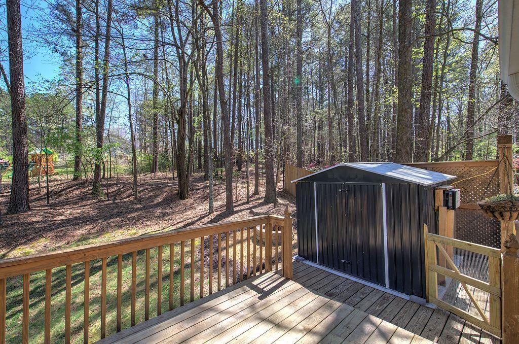 205 Cryder Lane Canton, GA 30115 - Photo 34 of 38 a view of a wooden door with a yard