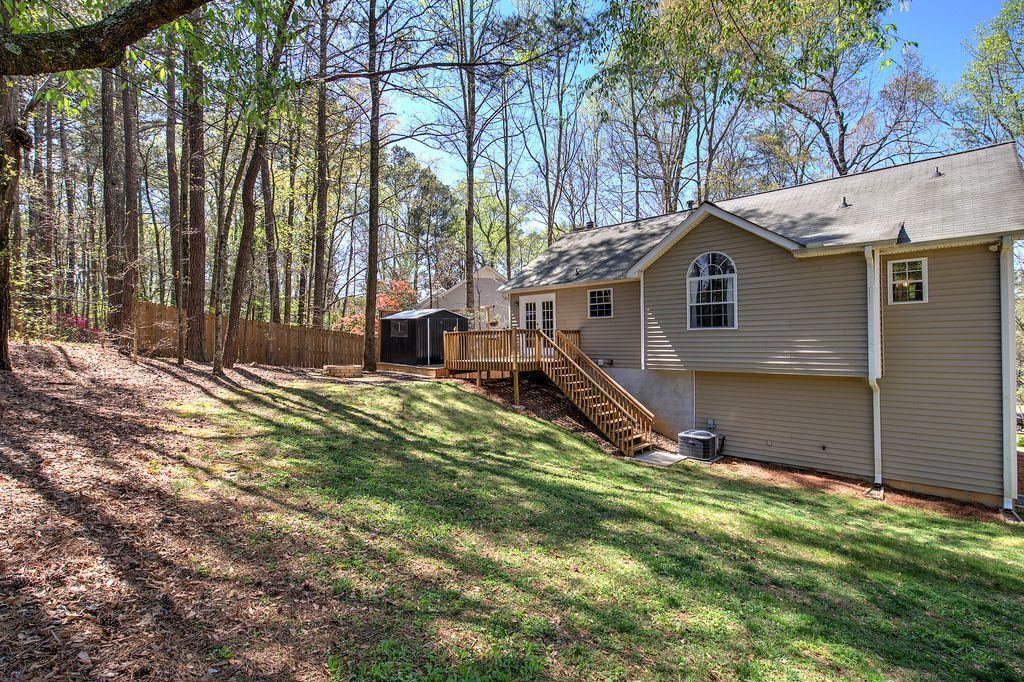 205 Cryder Lane Canton, GA 30115 - Photo 37 of 38 a house view with a backyard space