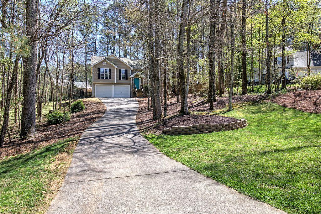 205 Cryder Lane Canton, GA 30115 - Photo 4 of 38 a front view of house with yard
