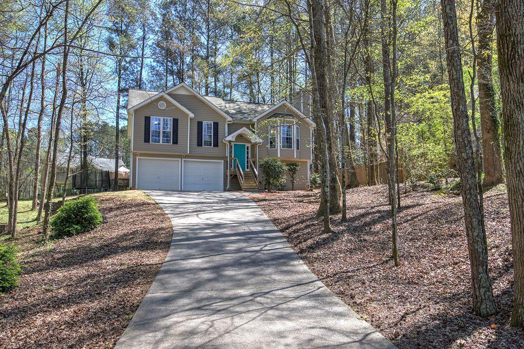 205 Cryder Lane Canton, GA 30115 - Photo 5 of 38 a front view of a house with a yard