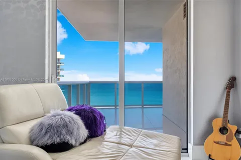 a bedroom with a bed and a mirror