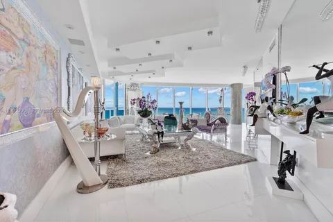 a view of a living room and chandelier