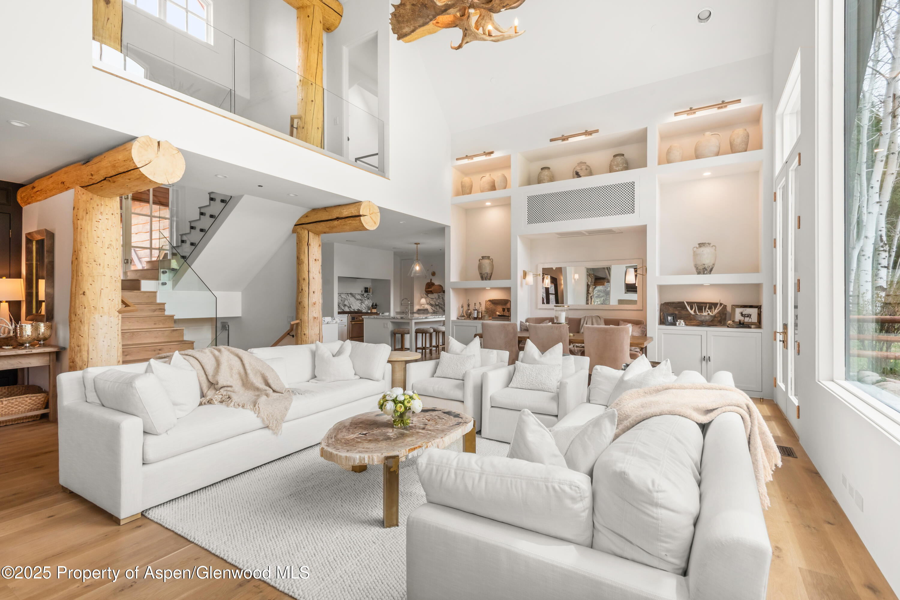 1495 Homestake Drive, Unit 2 Aspen, CO 81611 - Photo 11 of 42 a living room with furniture or outdoor view and a large window