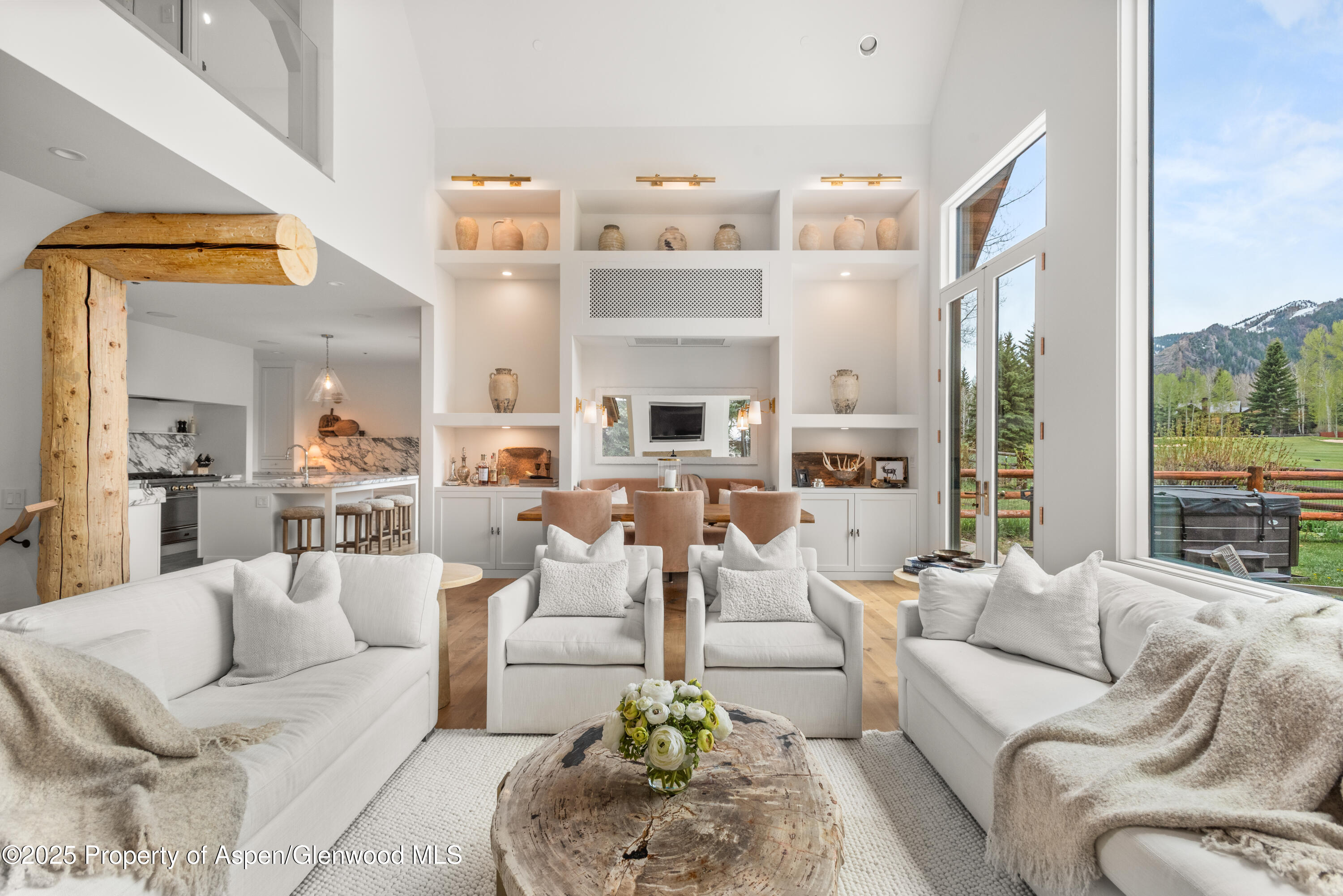 1495 Homestake Drive, Unit 2 Aspen, CO 81611 - Photo 12 of 42 a living room with fireplace furniture and a large window