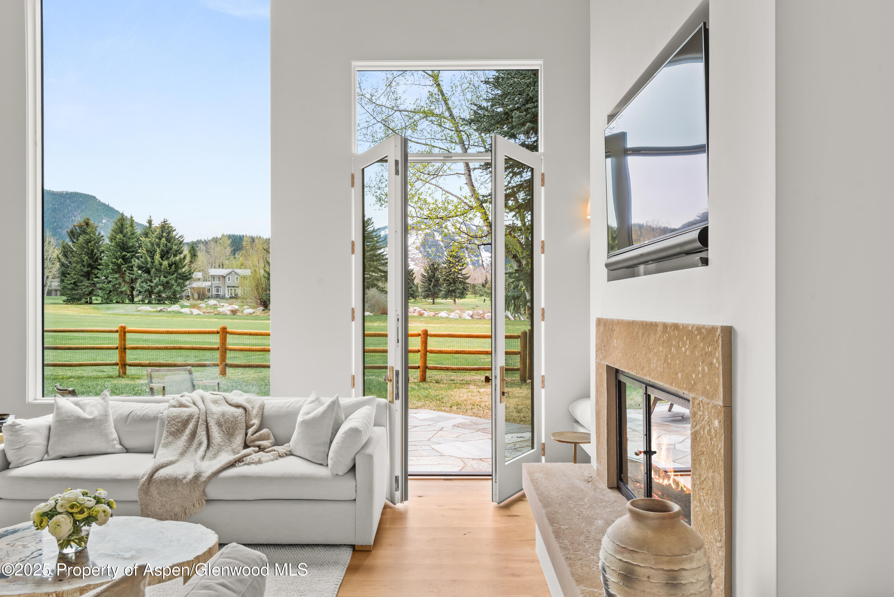 1495 Homestake Drive, Unit 2 Aspen, CO 81611 - Photo 14 of 42 a living room with furniture and a large window