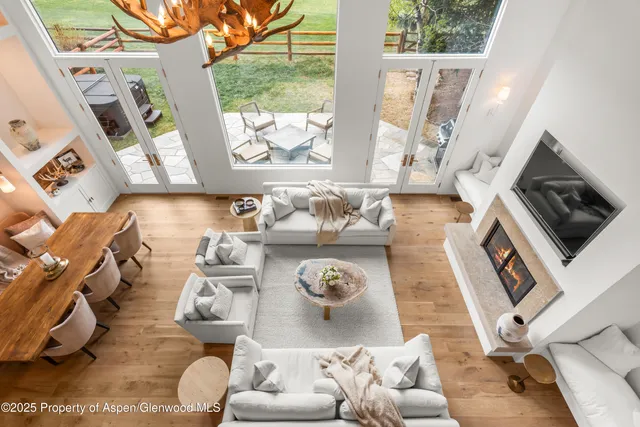 a bedroom with a bed and glass walk in closet