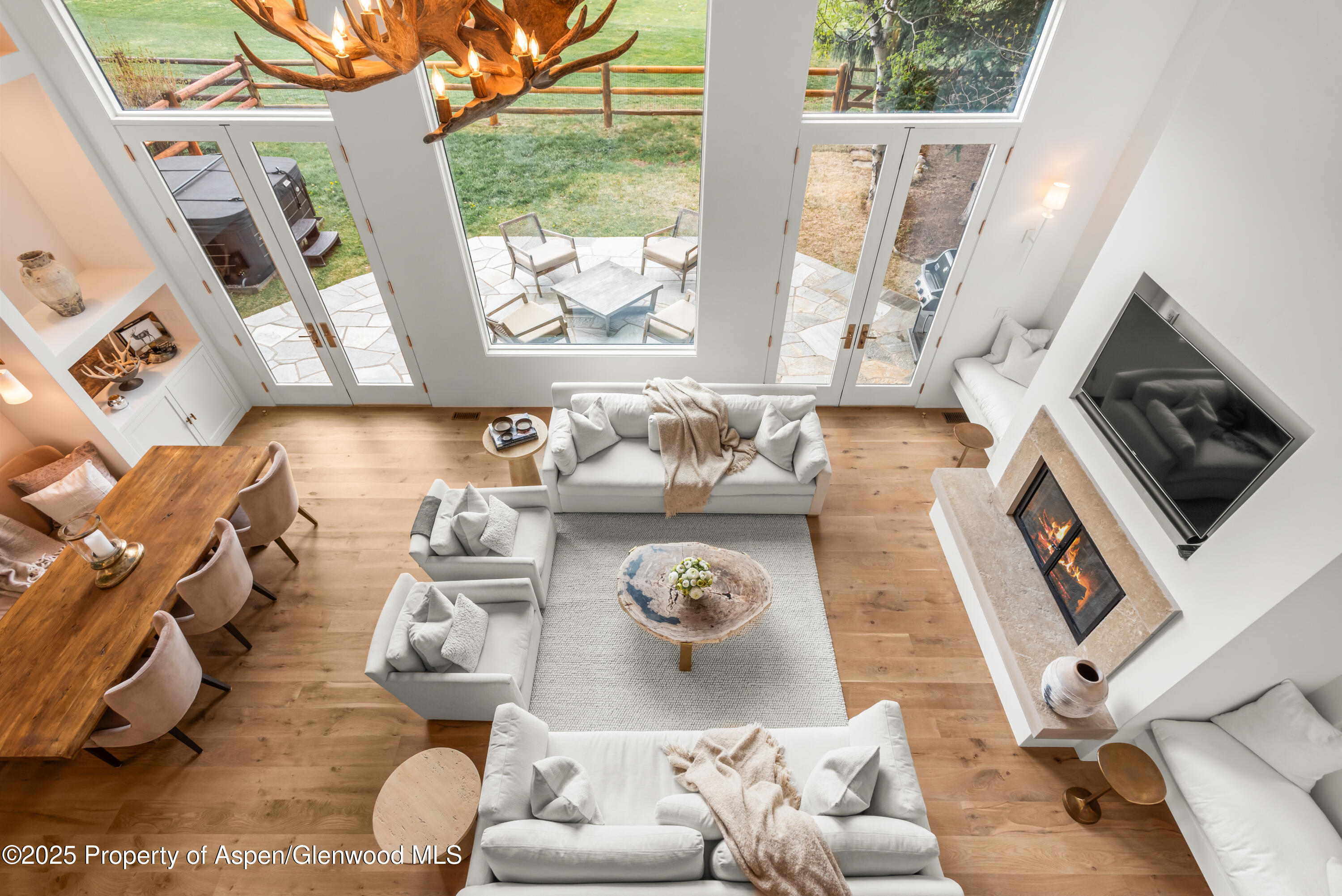 1495 Homestake Drive, Unit 2 Aspen, CO 81611 - Photo 16 of 42 a living room with furniture and a flat screen tv