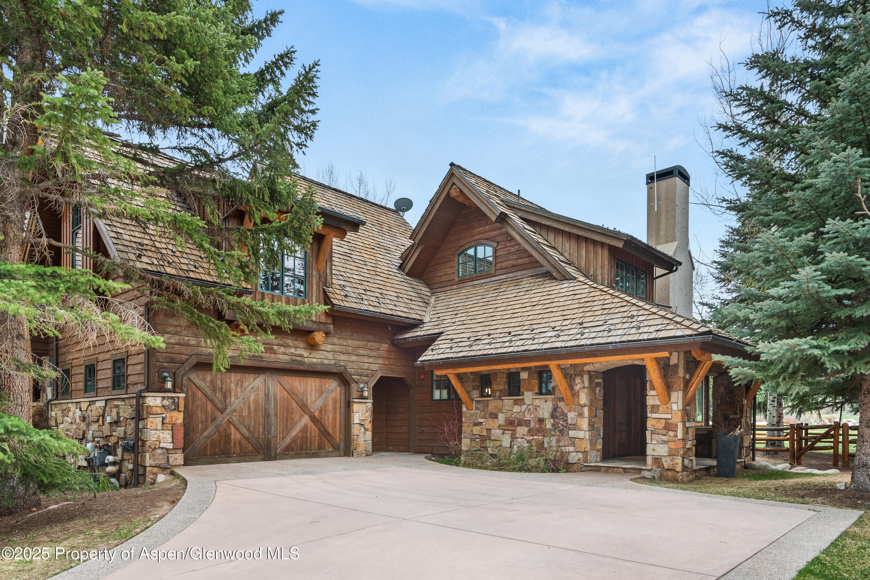 1495 Homestake Drive, Unit 2 Aspen, CO 81611 - Photo 2 of 42 front view of a house with a street