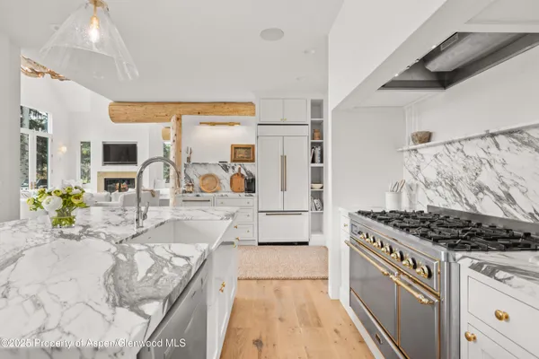 a bathroom with a sink a toilet a shower and a mirror