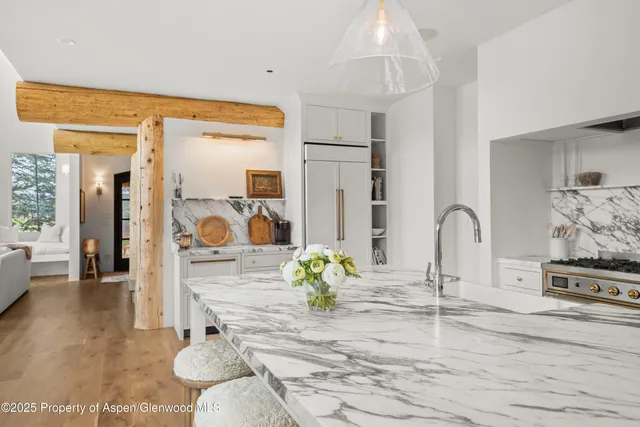 a bedroom with a bed and a chair